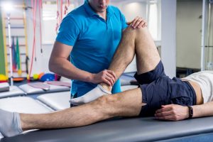 physiotherapist helping a patients knee, buderim, sunshine coast, QLD
